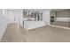 Spacious kitchen with stainless steel appliances, center island with quartz countertops and tile flooring at 10230 E Utah Ave, Mesa, AZ 85212
