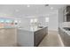 Spacious kitchen features a large center island with quartz countertops, open concept design, and ample natural light at 10230 E Utah Ave, Mesa, AZ 85212