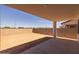 Spacious backyard features a covered patio, block fencing, and desert landscaping, perfect for outdoor living and entertaining at 10236 E Utah Ave, Mesa, AZ 85212