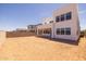 Large backyard with covered patio and views of neighboring houses at 10236 E Utah Ave, Mesa, AZ 85212