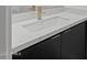 Modern bathroom sink with white countertop and gold faucet at 10236 E Utah Ave, Mesa, AZ 85212