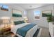 Well decorated bedroom featuring stylish decor, multiple windows, and comfortable furnishings at 10236 E Utah Ave, Mesa, AZ 85212