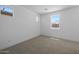 Unfurnished bedroom featuring natural light from multiple windows and neutral carpet at 10236 E Utah Ave, Mesa, AZ 85212