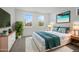 Cozy bedroom with stylish decor, large windows, and comfortable furnishings at 10236 E Utah Ave, Mesa, AZ 85212