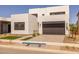 Contemporary two-story home with desert landscaping and a spacious two-car garage at 10236 E Utah Ave, Mesa, AZ 85212