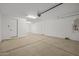 Spacious garage with ample lighting and epoxy floor at 10236 E Utah Ave, Mesa, AZ 85212