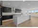 Spacious kitchen showcasing stainless steel appliances, a large island, and modern cabinetry at 10236 E Utah Ave, Mesa, AZ 85212