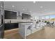 Modern kitchen boasting a large island, stainless steel appliances, and stylish seating at 10236 E Utah Ave, Mesa, AZ 85212