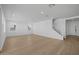 Spacious living room featuring hardwood floors, stairs, and neutral wall color at 10236 E Utah Ave, Mesa, AZ 85212