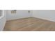 Open-concept area with hardwood floors and ample natural light from windows at 10236 E Utah Ave, Mesa, AZ 85212