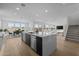 Bright, open-concept living space featuring kitchen, dining, and living areas with ample natural light at 10236 E Utah Ave, Mesa, AZ 85212