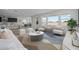 Inviting living room with ample natural light, featuring stylish furniture and an open concept design at 10236 E Utah Ave, Mesa, AZ 85212