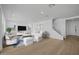 Stylishly furnished living room with hardwood floors, modern decor, and a staircase at 10236 E Utah Ave, Mesa, AZ 85212