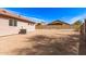 Backyard with desert landscaping and block fencing at 11266 E Dartmouth Cir, Mesa, AZ 85207