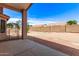 Backyard featuring a patio area with red brick, a yard with rocks, and a tall brick wall at 11266 E Dartmouth Cir, Mesa, AZ 85207