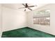 Well-lit bedroom with a large window providing natural light and views of the surrounding landscape at 11266 E Dartmouth Cir, Mesa, AZ 85207
