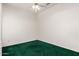 A simple bedroom with green carpet, awaiting your personal touch to transform the space at 11266 E Dartmouth Cir, Mesa, AZ 85207