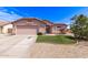 Beautiful single-level home with a two-car garage, desert landscaping, and well-manicured front yard at 11266 E Dartmouth Cir, Mesa, AZ 85207