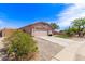 Cozy single-story home with a two-car garage, desert landscaping, and a welcoming front yard at 11266 E Dartmouth Cir, Mesa, AZ 85207