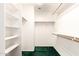 Spacious walk-in closet with built-in shelving and hanging rods, perfect for organizing your wardrobe at 11266 E Dartmouth Cir, Mesa, AZ 85207