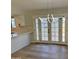 Contemporary dining area with modern chandelier and access to the outdoors through French doors at 1301 N 44Th St, Phoenix, AZ 85008