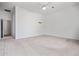 Spacious bedroom featuring neutral carpet, a ceiling fan, and ample natural light at 13134 W Los Bancos Ct, Sun City West, AZ 85375