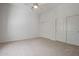 A bright bedroom with a ceiling fan, carpet and a sliding closet at 13134 W Los Bancos Ct, Sun City West, AZ 85375