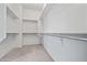 Spacious walk-in closet with carpeted flooring and multiple shelves at 13134 W Los Bancos Ct, Sun City West, AZ 85375