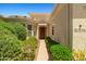 Inviting front entrance with manicured shrubs and walkway leading to the front door with clear house numbers at 13134 W Los Bancos Ct, Sun City West, AZ 85375