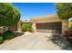A single-story home with well-maintained landscaping, a neutral color palette, and a tile roof at 13134 W Los Bancos Ct, Sun City West, AZ 85375