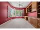 Spacious home office with custom built-ins, ample storage and natural light at 13134 W Los Bancos Ct, Sun City West, AZ 85375
