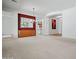 Large living room featuring a serving buffet, mirror and open access to other living areas at 13134 W Los Bancos Ct, Sun City West, AZ 85375