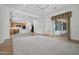 Open-concept living area showcasing kitchen, great room, and backyard access at 13134 W Los Bancos Ct, Sun City West, AZ 85375