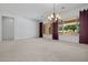 Spacious living room with a large picture window with backyard views at 13134 W Los Bancos Ct, Sun City West, AZ 85375