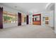 Expansive living room with large windows, buffet, and an open floor plan at 13134 W Los Bancos Ct, Sun City West, AZ 85375