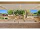 Outdoor living space featuring a pergola, water fountain, built-in seating and BBQ, perfect for entertaining at 13134 W Los Bancos Ct, Sun City West, AZ 85375
