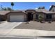Charming single story home with desert landscaping, tile roof, and inviting curb appeal in a warm, sunny setting at 1314 S Larkspur St, Gilbert, AZ 85296
