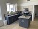 Bright kitchen with granite countertops, stainless steel appliances, a center island, and a window at 1314 S Larkspur St, Gilbert, AZ 85296