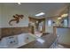 Spacious bathroom featuring a jetted tub, tiled shower, and vanity with granite counters at 1401 E Boulder Pass Pass, Carefree, AZ 85377
