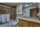Bathroom featuring granite countertops, custom cabinetry, and tiled shower with glass door at 1401 E Boulder Pass Pass, Carefree, AZ 85377