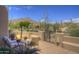 Charming outdoor seating area featuring comfortable chairs, a table, and desert landscaping at 1401 E Boulder Pass Pass, Carefree, AZ 85377