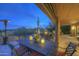 Relaxing covered patio with dining table, cacti and desert views, perfect for outdoor enjoyment at 1401 E Boulder Pass Pass, Carefree, AZ 85377
