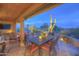 Relaxing covered patio with dining table, cacti and desert views, perfect for outdoor enjoyment at 1401 E Boulder Pass Pass, Carefree, AZ 85377