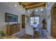 Bright dining room with beamed ceiling, chandelier, and large windows at 1401 E Boulder Pass Pass, Carefree, AZ 85377