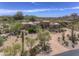Beautiful desert home boasts manicured landscaping, adding to the property's curb appeal at 1401 E Boulder Pass Pass, Carefree, AZ 85377