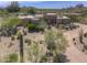 Stunning exterior view of desert home with mature landscaping and private driveway at 1401 E Boulder Pass Pass, Carefree, AZ 85377