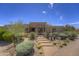 Beautiful desert home features a landscaped front yard and covered entryway at 1401 E Boulder Pass Pass, Carefree, AZ 85377