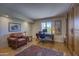 Cozy home office featuring built-in shelving, comfortable leather chair, and plenty of natural light at 1401 E Boulder Pass Pass, Carefree, AZ 85377