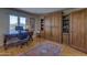 Home office space featuring built-in shelving and a large picture window with views of the desert landscape at 1401 E Boulder Pass Pass, Carefree, AZ 85377