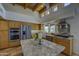 Kitchen features granite countertops, stainless appliances, and knotty alder cabinets at 1401 E Boulder Pass Pass, Carefree, AZ 85377